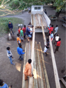 Unloading lumber for the roof